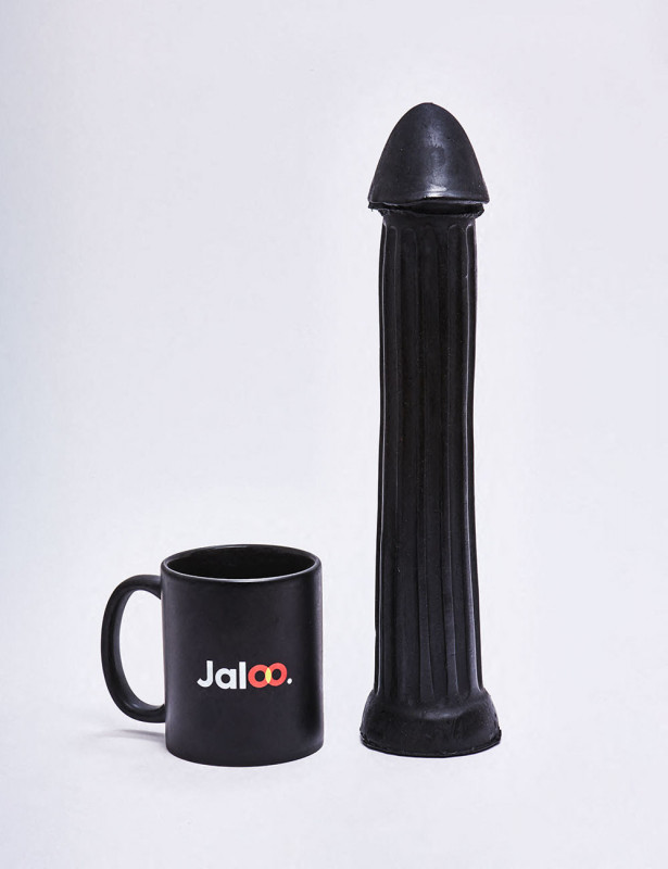 XL Dildo from All Black in 31cm compared to a mug XL Dildo from All Black in 31cm compared to a mug
