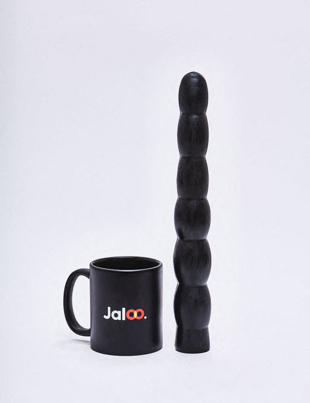 XL Dildo from All Black in 32cm compared to a mug XL Dildo from All Black in 32cm compared to a mug