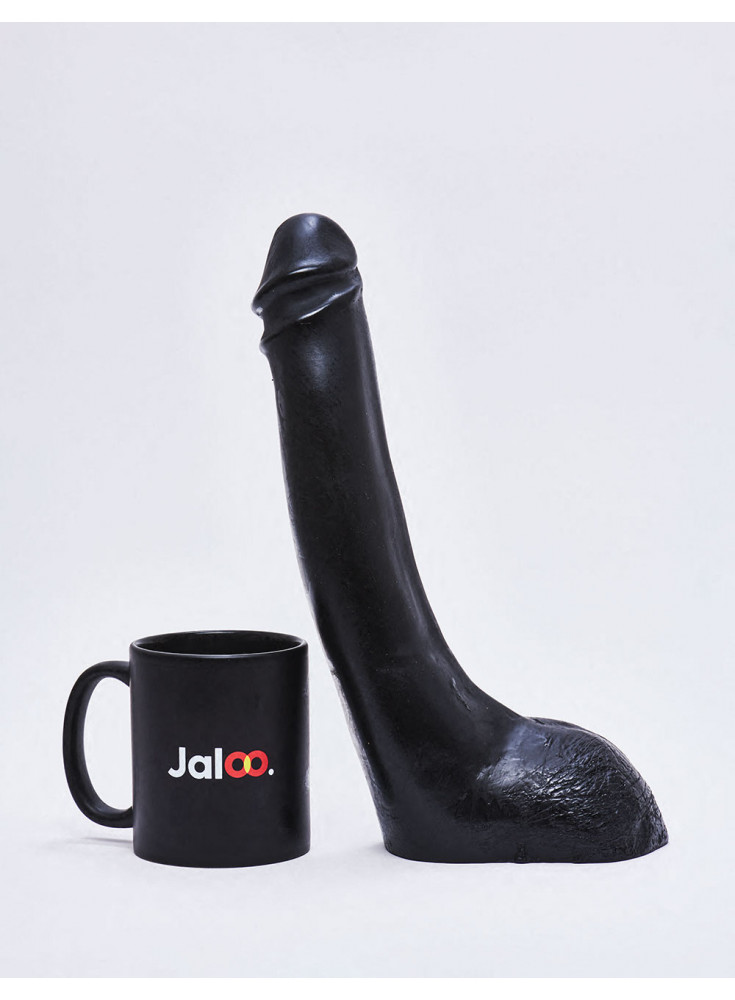 XL Dildo from All Black in 28cm compared to a mug